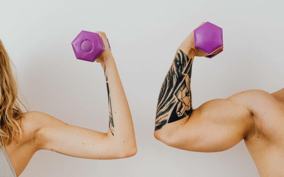 man and woman showing off their toned arms while carrying weights