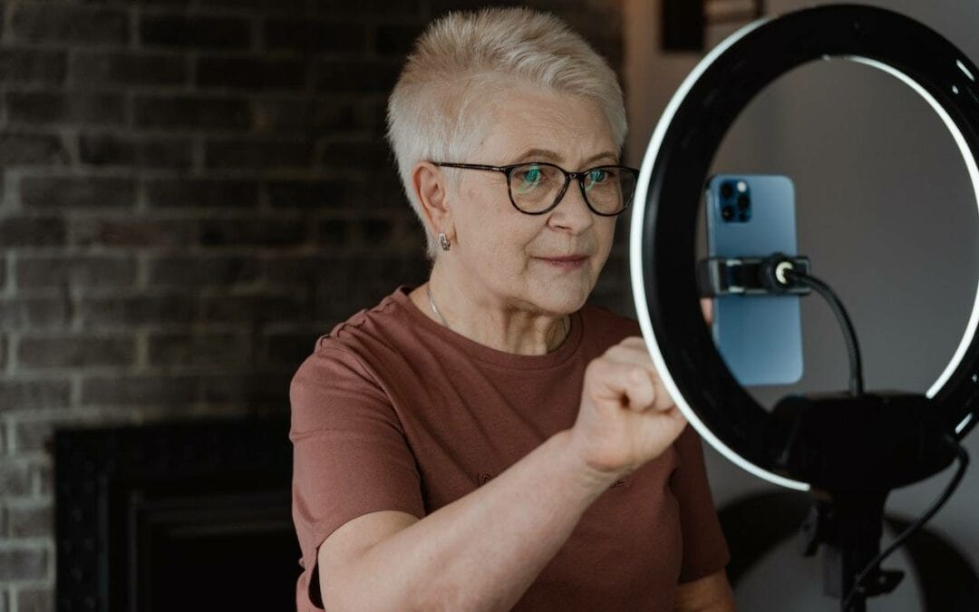 older woman recording a video of herself