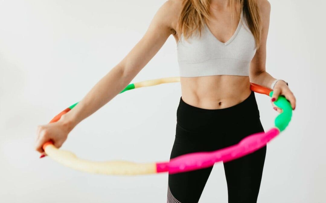 fit woman with hula hoop